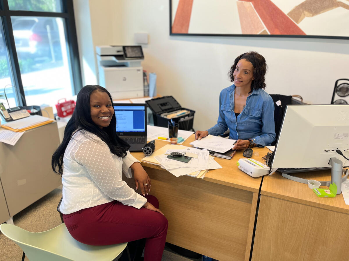 Everyone&#39;s favorite housing counselor helping a new resident with her paperwork.
